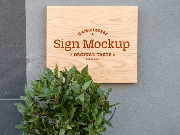 Front View of a Wooden Shop Sign on Wall Mockup 1