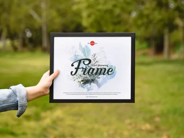 Girl Showing Frame in a Outdoor Environment Mockup 1