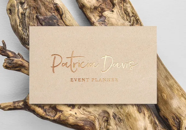Gold Foil Effect Business Card on a Wood Branch Mockup 1