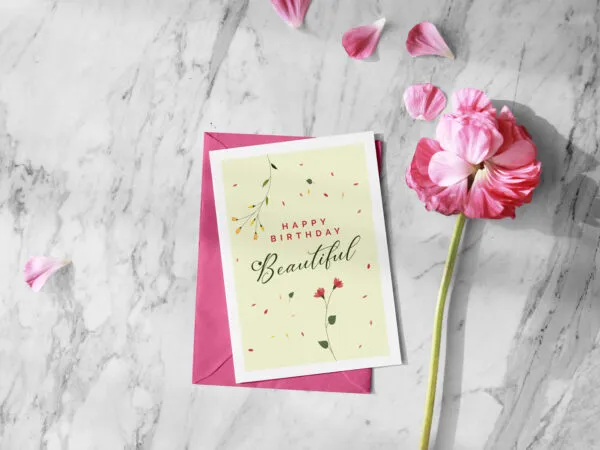 Greeting Card and Envelope Mockup Next to a Flower 1