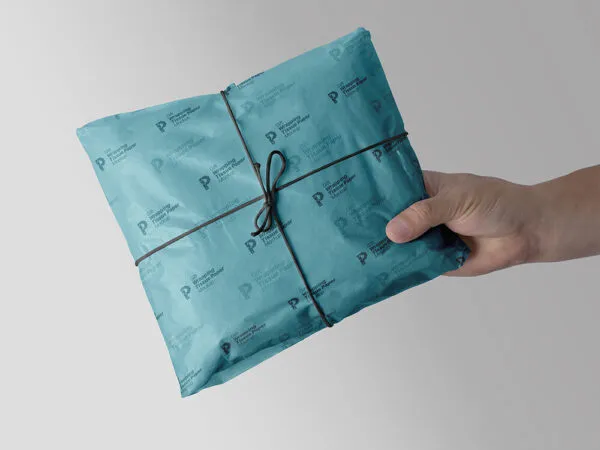 Hand Holding Gift Wrapping Tissue Paper Mockup 1