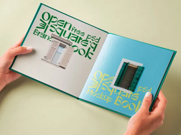 Hand Holding Hardcover Open Book Mockup in Perspective View 1