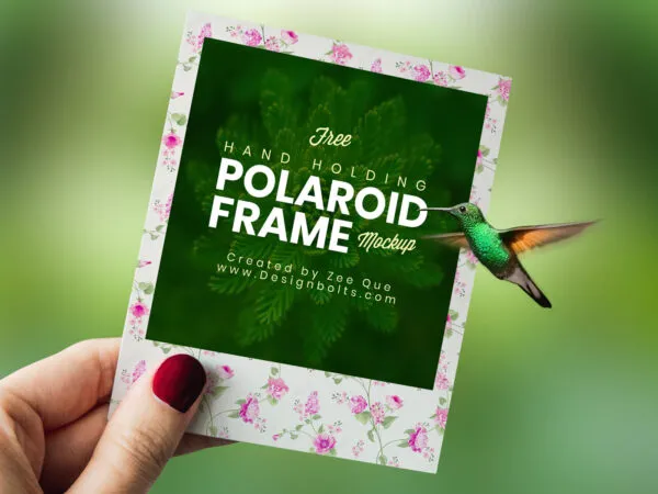 Hand holding Polaroid Photo Frame Mockup 1