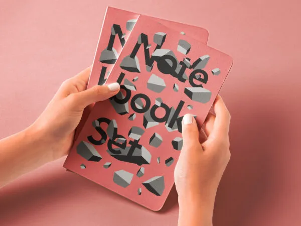 Hands Holding Notebook Mockup in Perspective View 1