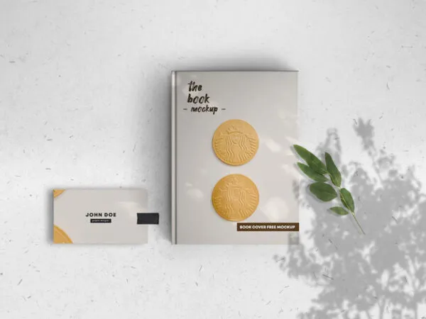 Hardcover Book Along with Business Card in Top View Mockup 1