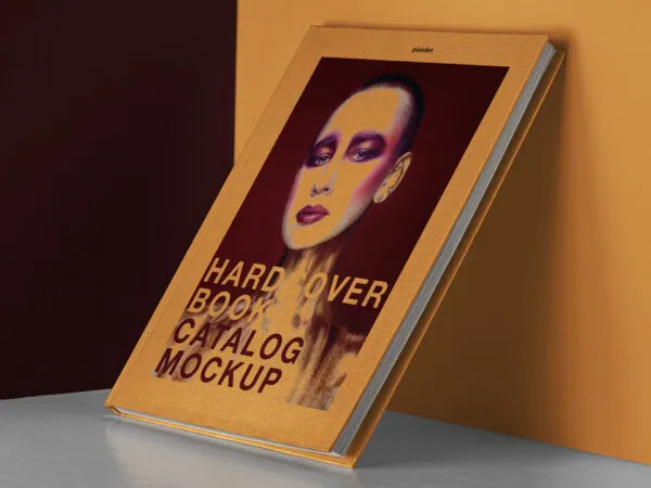Hardcover Book Catalog Mockup Relying on Wall 1