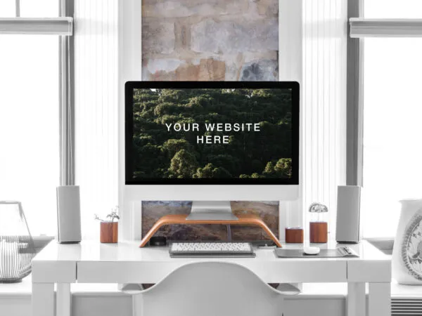 Hyper Realistic iMac on a Desk in a Room Front View Mockup 1