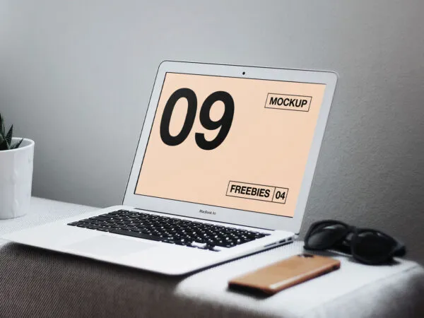 Interior View of MacBook on Table with Related Items Mockup 1