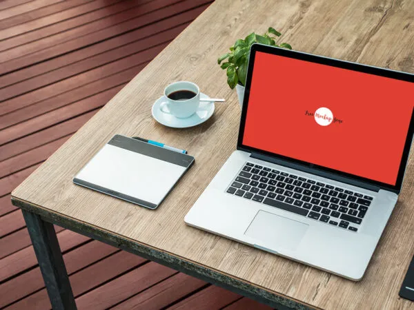 Laptop Mockup on Wooden Desk Outdoor at a 34 Angle View 1
