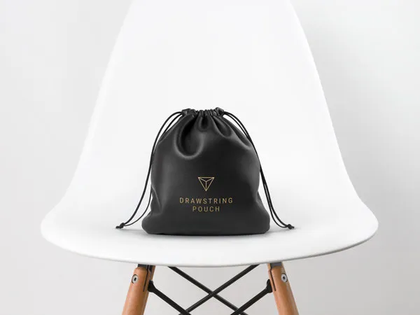 Leather Drawstring Pouch Placed on a White Chair Mockup 1