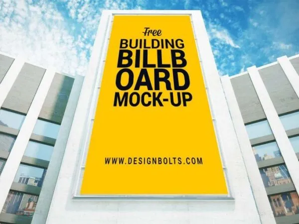 Low Angle View Mockup of a Vertical Billboard on Building 1