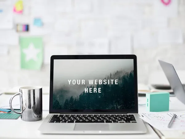 MacBook Mockup on a White Desk 1