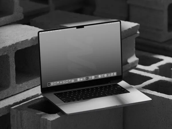 MacBook Pro Mockup on Bricks in Perspective Sight 1