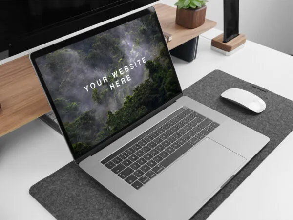 MacBook Pro Side View on Table with Similar Items Mockup 1