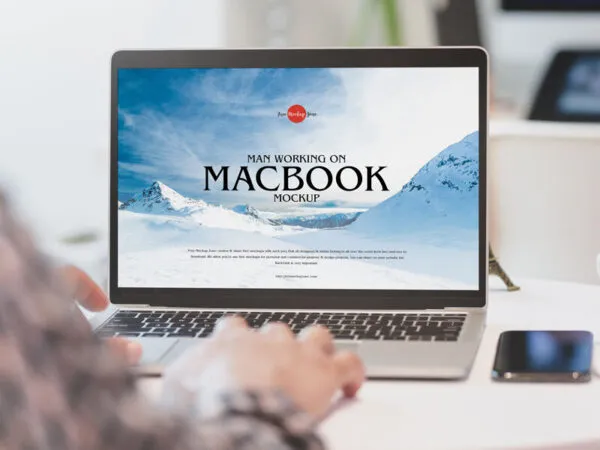 Man Working on an Opened MacBook Mockup 1