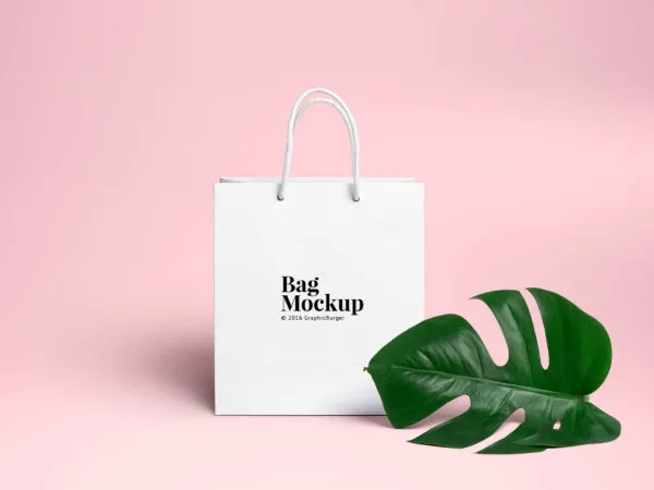 Minimal Shopping Bag Beside a Large Leaf Mockup 1