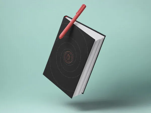 Mockup Displaying Floating Hardcover Book and Pen 1
