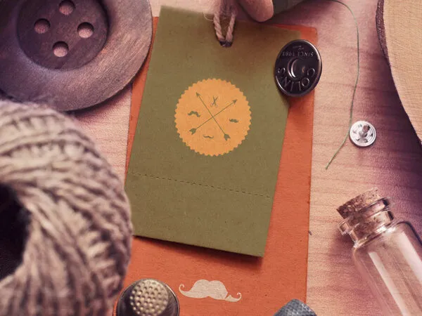 Mockup Featuring Four Vintage Scenes of Label Tags Decorated with Sewing Items 1