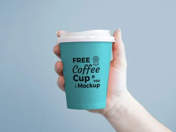 Mockup Featuring Front View of Hand Holding Paper Coffee Cup 1