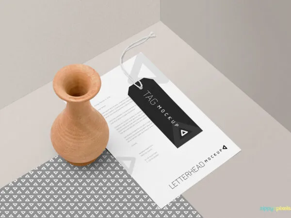 Mockup Featuring Letterhead and Tag with a Decorative Vase 1