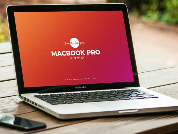 Mockup Featuring MacBook Pro on Wooden Table with Side View 1