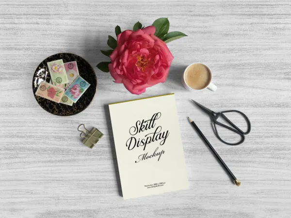 Mockup Featuring Overhead View of Drawing Pad Stamps Flower and Cup 1