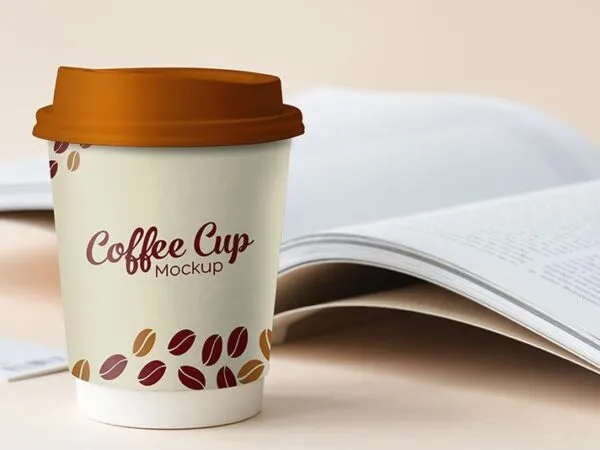 Mockup Featuring Standing Paper Coffee Cup with Book at Background 1
