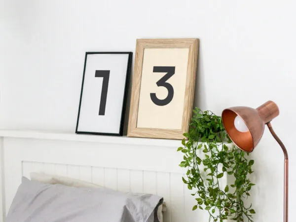 Mockup Featuring Two Frames Against the Wall in Bedroom Setting 1