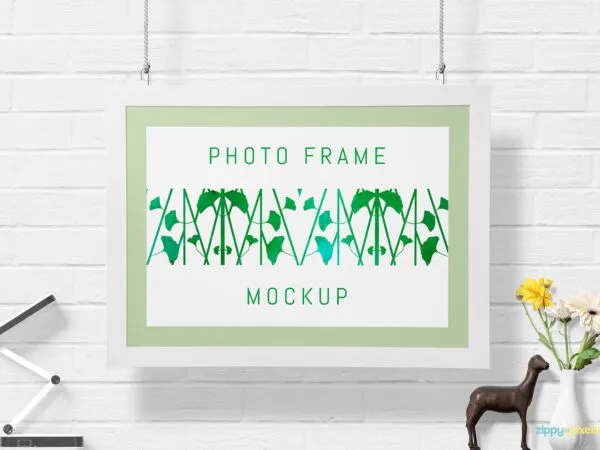 Mockup Featuring a Hanging Photo Frame on the Wall 1