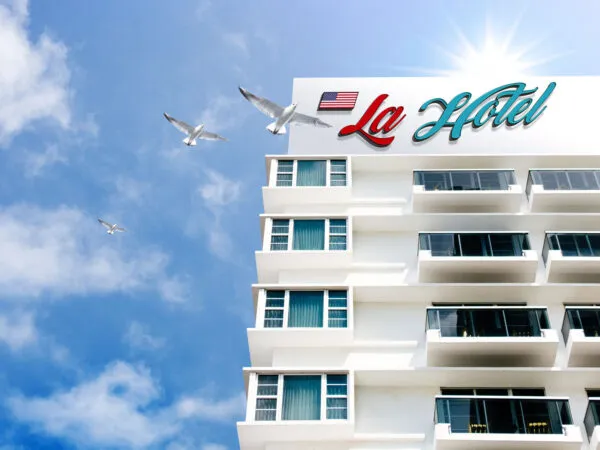 Mockup Featuring a Low Angle Shot of Hotel Building Logo 1