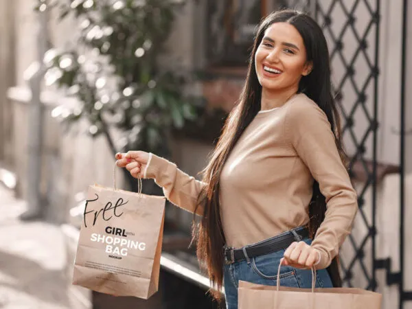 Mockup Showcasing Girl Holding Shopping Bags in Outdoor Setting 1