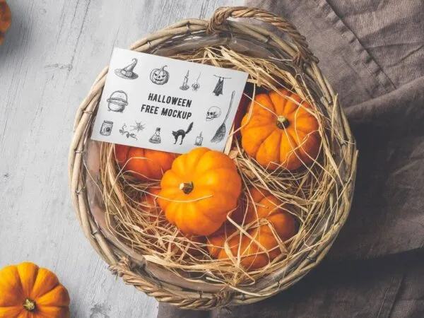 Mockup Showing Halloween Card on a Basket Filled with Tiny Pumpkins 1
