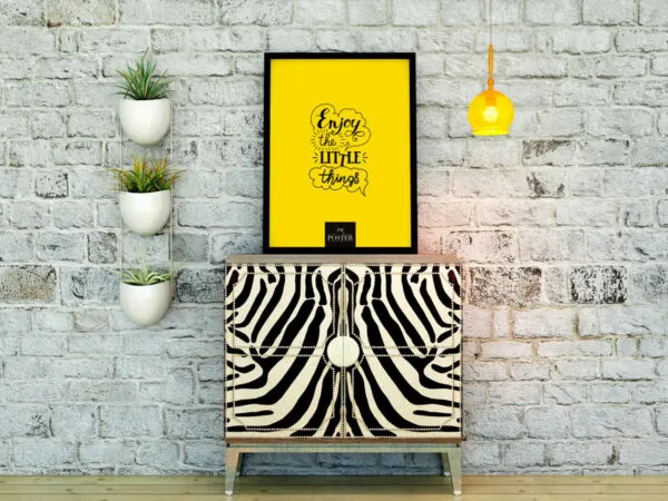 Mockup Showing Poster on Zebra Table in a Setting Decorated with Vases Lamp and Brick Wall 1