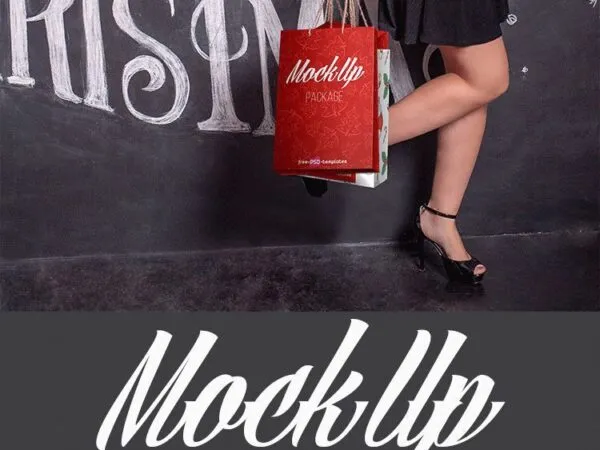 Mockup Showing a Woman Holding Christmas Shopping Bags 1