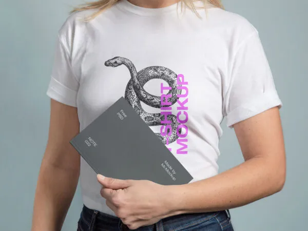Mockup Showing a Woman Wearing T Shirt and Holding a Notebook 1