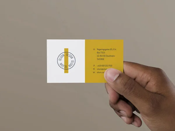 Mockup a Mans Hand Holding a Business Card 1