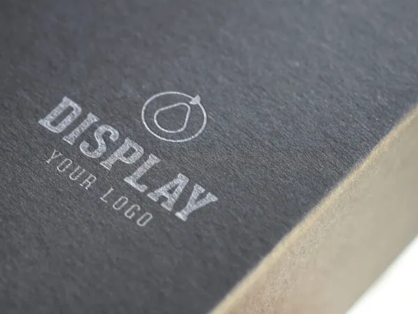 Mockup for a Close Shot of a Logo on a Dark Color Box 1