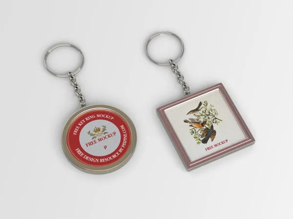 Mockup of 2 Keychains Laid Next to Each Other in Overhead View 1