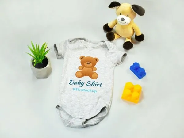 Mockup of Baby Onesie with Teddy Bear and Blocks toys 1