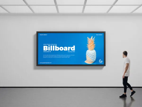 Mockup of Indoor Horizontal Billboard Featuring a Man Passing by 1