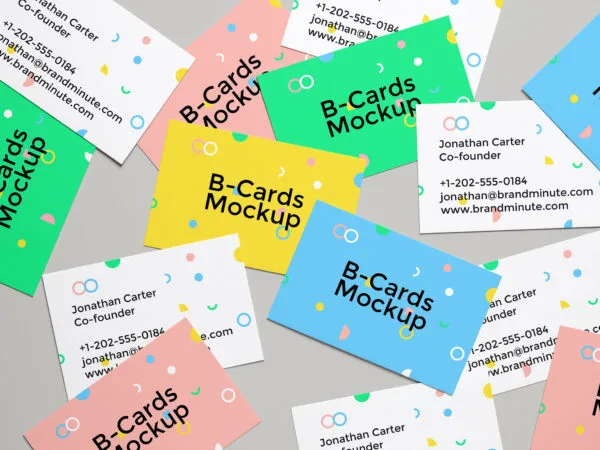 Mockup of Realistic Business Cards Scattered on the Screen 1