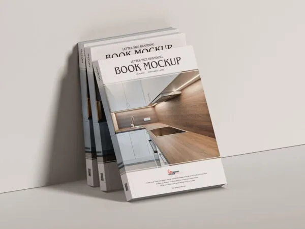 Mockup of Three Branding Books Leaning Against the Wall in Half Side View 1