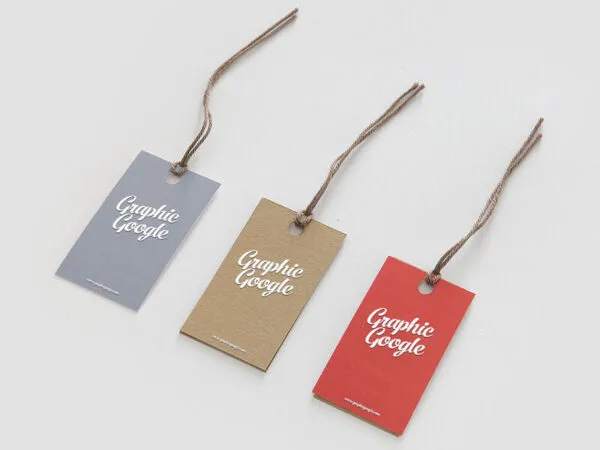 Mockup of Three Cardboard Hangtags Laid in Perspective 1
