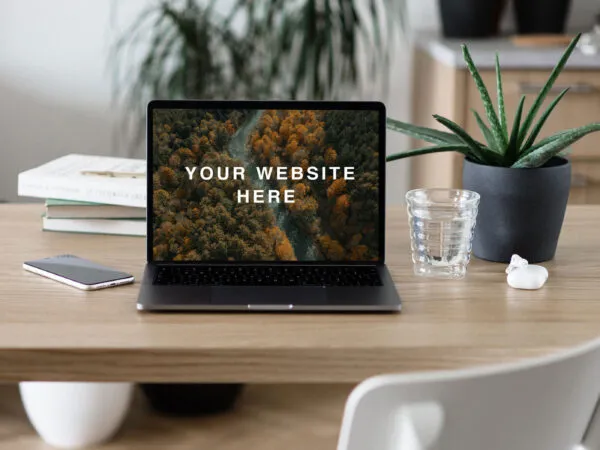 Mockup of a Front View MacBook Pro on Table 1