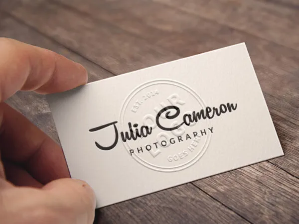 Mockup of a Hand Holding an Embossed Business Card 1