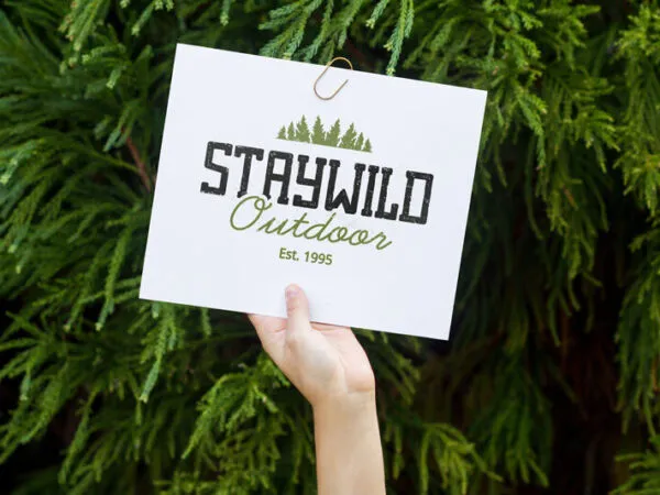 Mockup of a Persons Hand Holding Up a Card in the Air 1