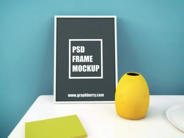 Mockup of a Standing Photo Frame on a Table 1