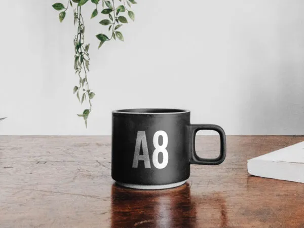 Mug on Table Mockup with a Book 1
