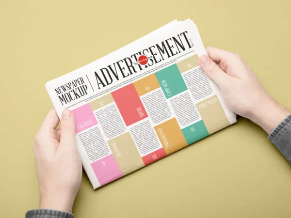 Newspaper Mockup Held by Hands in Perspective 1