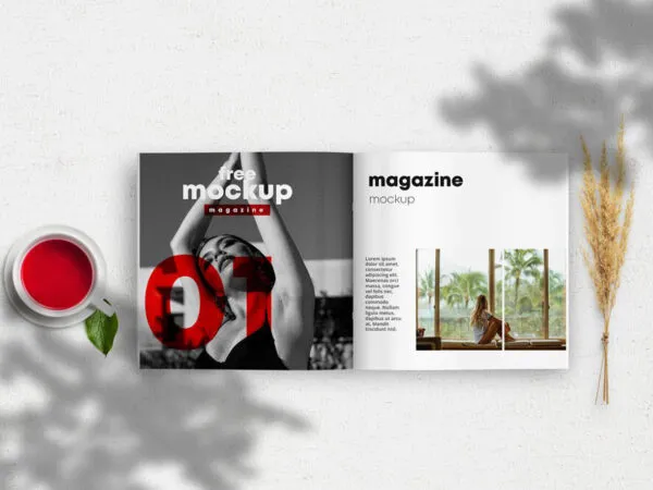 Opened Magazine Mockup Between a Cup of Tea and a Wheat Branch 1